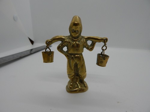 Vintage brass man carrying - vintage,