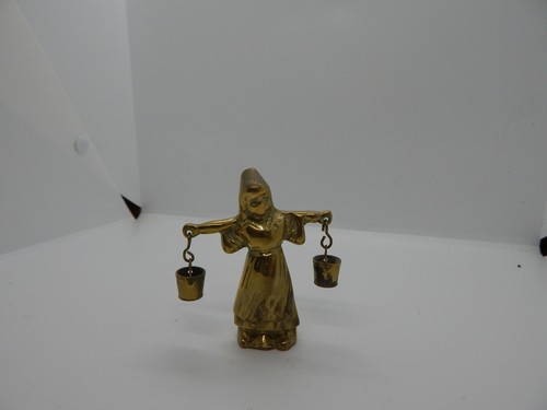 Vintage brass woman carrying - woman,
